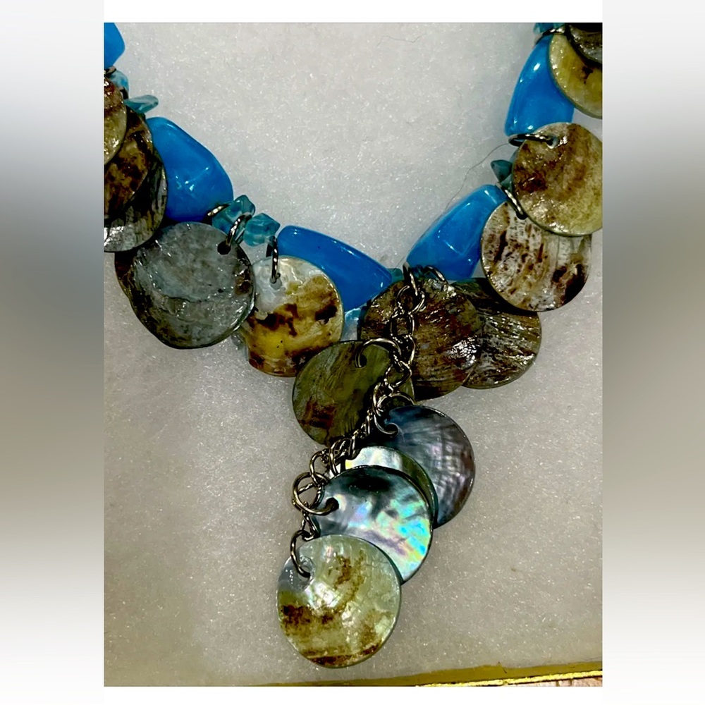 Blue suede Y necklace with shells and blue stones.